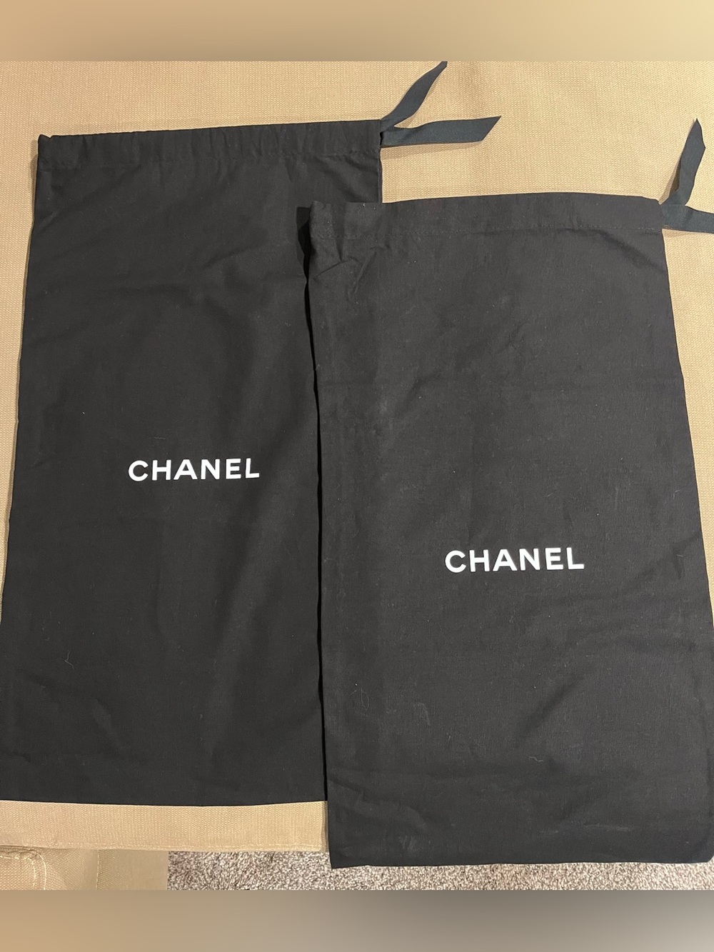 CHANEL Pair of Black Fabric Dust Bags with CHANEL white printed Logo